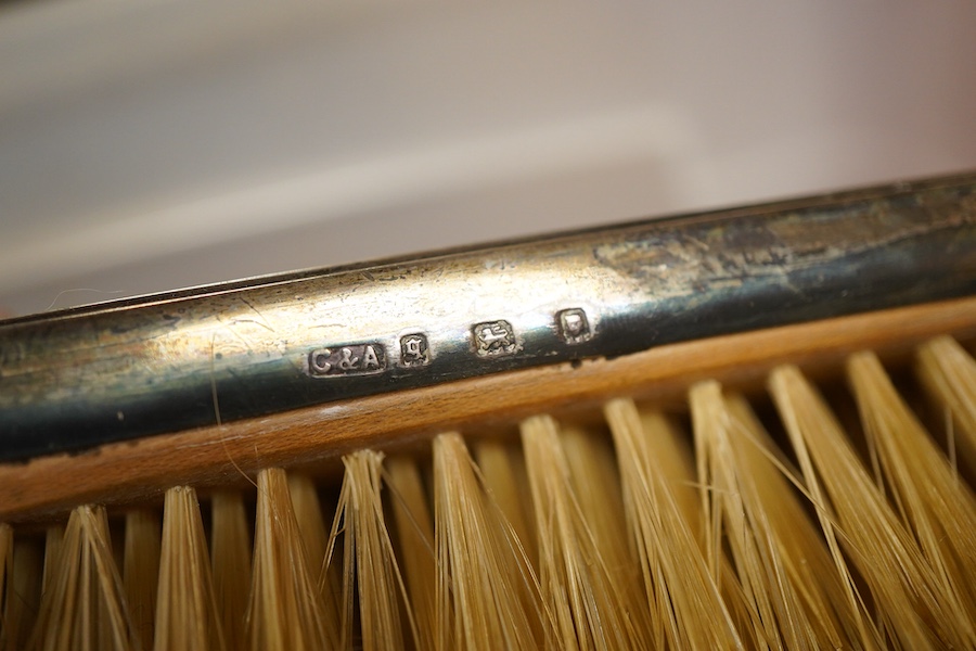 Two George V silver mounted tortoiseshell five piece dressing table sets, first Birmingham, 1925, Levi & Salaman, inlaid with fan paterae second in Art Deco style London, 1931, Collett & Anderson, (10)